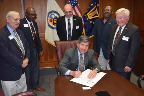 Retired Rear Adm. Robert J. Bianchi signs a formal statement of support for Guard, Reserve Thumbnail