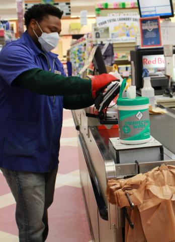A store worker at the Daegu, South Korea, Commissary wears PPE Thumbnail