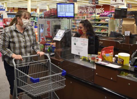 A cashier rings up a customer at the Ramstein Air Base Commissary Thumbnail