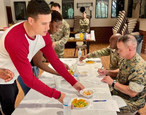 Young soldiers present nutritious meals they've cooked to post and DeCA judges Thumbnail