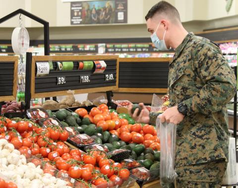 A young Marine shops for produce at the Naval Air Station Oceana Commissary Thumbnail