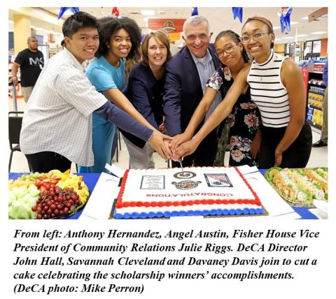 Scholarship winners cut cake