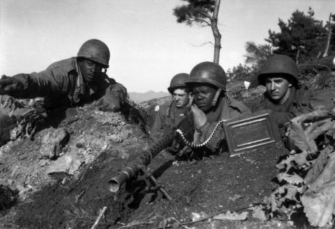 A machine gun crew scans North Korean positions north of the Chongchon River, Nov. 20, 1950. U. S. Army.